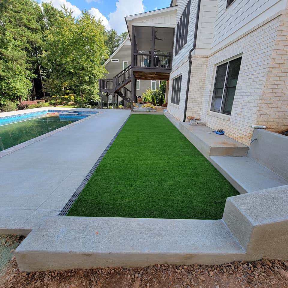After Pool Deck Wall & Turf Installation – Marietta