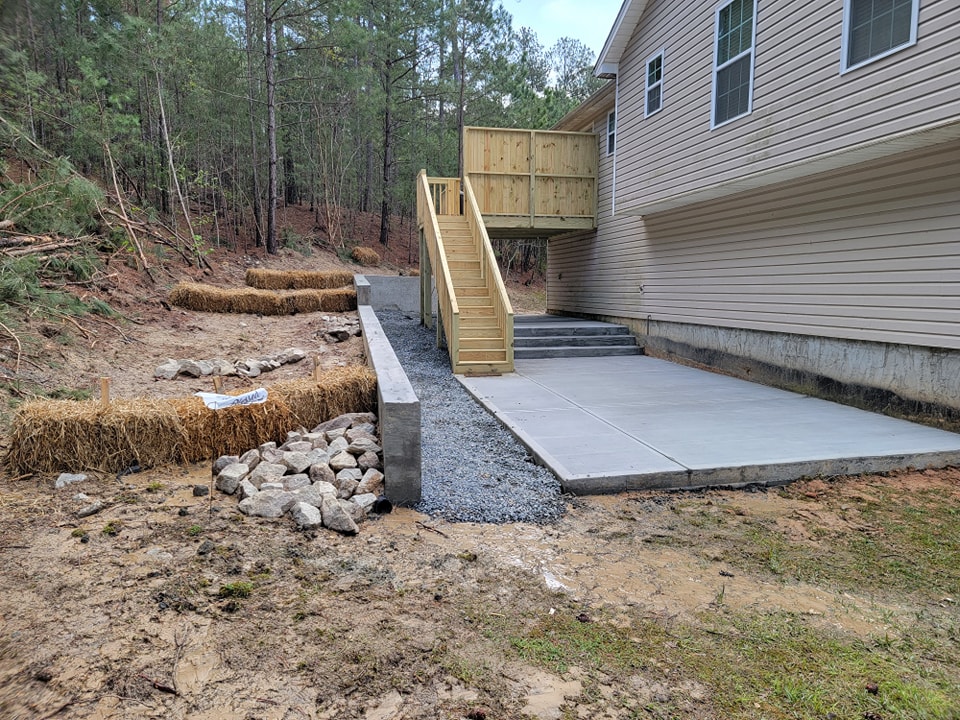 After Patio with Poured Concrete Retaining Wall – Dallas